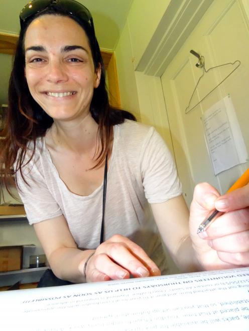 Laura Michaelian signs up for the Otago Healthy Living Trust's Fruit and Vege Co-op. Photo by Dan...