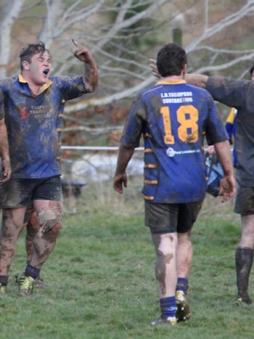 Lawrence players celebrate victory in the Otago countrywide final in Lawrence on Saturday. Photo...