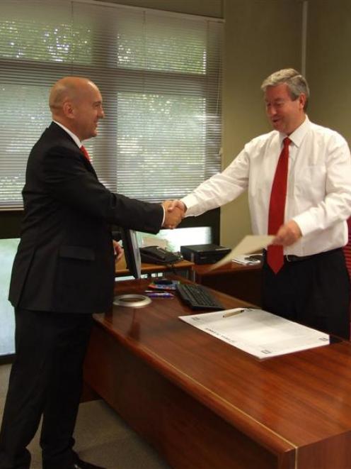 Lawyer Tim Cadogan, of Clyde (left), is sworn in as a Disputes Tribunal referee before Judge...