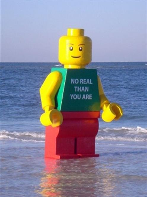 Lego man stands in the water at Siesta Key Public Beach in Sarasota, Florida. (AP Photo/Sarasota...