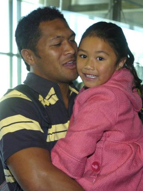 Highlanders midfield back Johnny Leota is greeted by daughter Brooklyn (5) at Dunedin Airport. ...