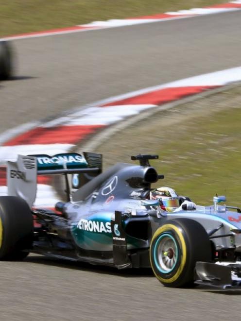 Lewis Hamilton leads Nico Rosberg around a bend. REUTERS/Aly Song