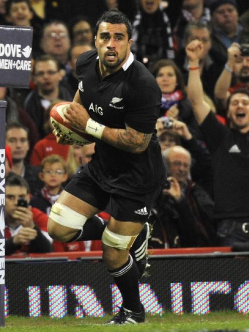 Liam Messam of New Zealand scores a try during their international rugby union match against...