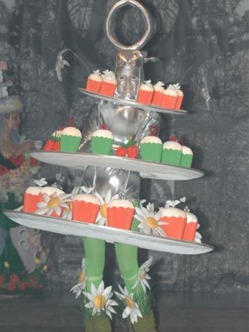 Libby Jack models the creation "High Tea on Buckingham" made by Bridget Paape and Sue Fussell at...