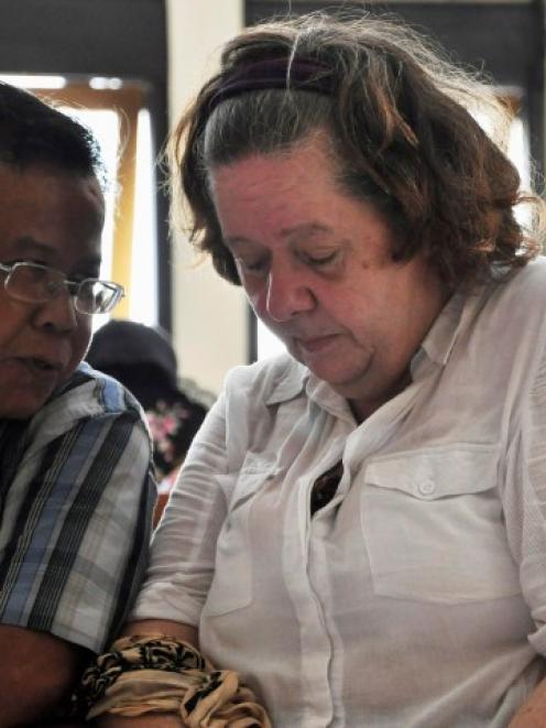 Lindsay Sandiford listens to her translator during her trial in Denpasar in Bali. REUTERS/Stringer