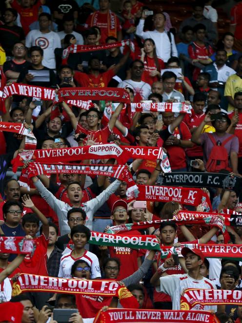 Liverpool had plenty of support at a training run in Malaysia prior to their game. Photo by Reuters.
