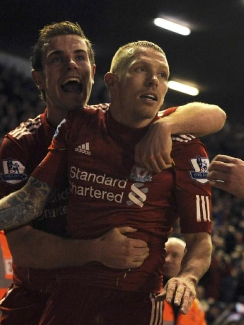 Liverpool's Craig Bellamy celebrates his goal against Manchester City with Jordan Henderson (L)...