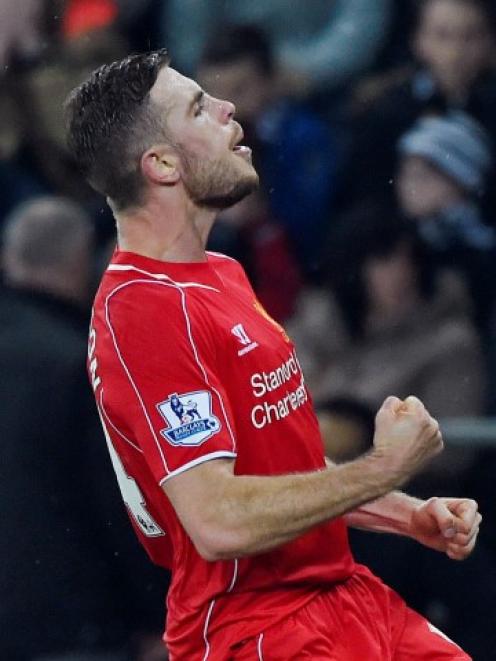 Liverpool's Jordan Henderson celebrates scoring against Swansea City. Photo: Reuters / Rebecca...