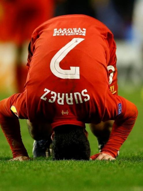 Liverpool's Luis Suarez reacts after his team lost their Europa League match against Zenit St....