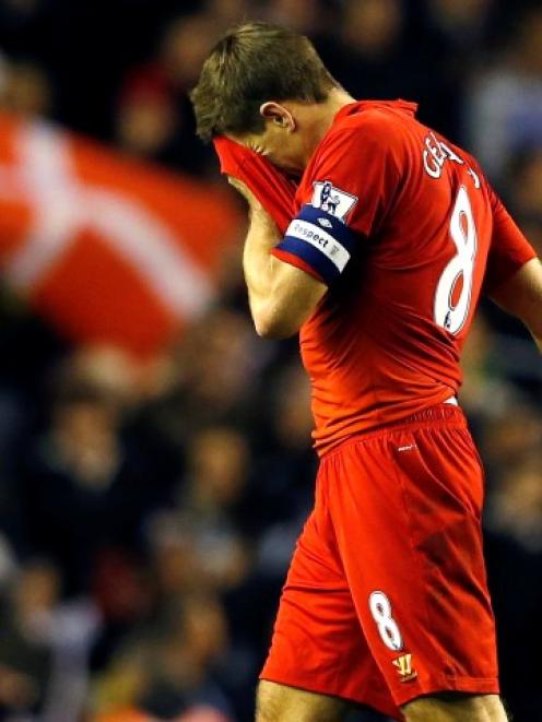 Liverpool's Steven Gerrard leaves the pitch after his team lost to Swansea in their English...