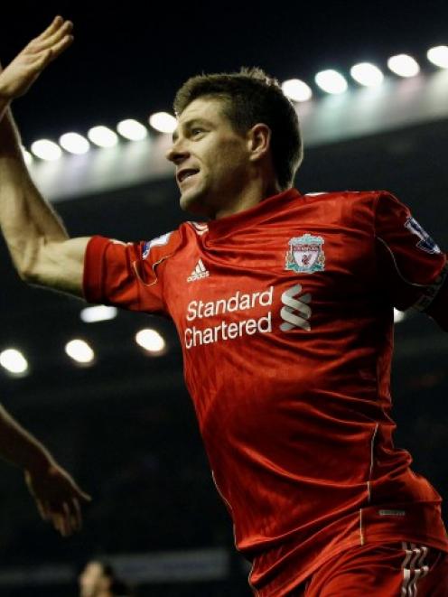 Liverpool's Steven Gerrard (R) celebrates scoring against Everton with teammate Jordan Henderson...