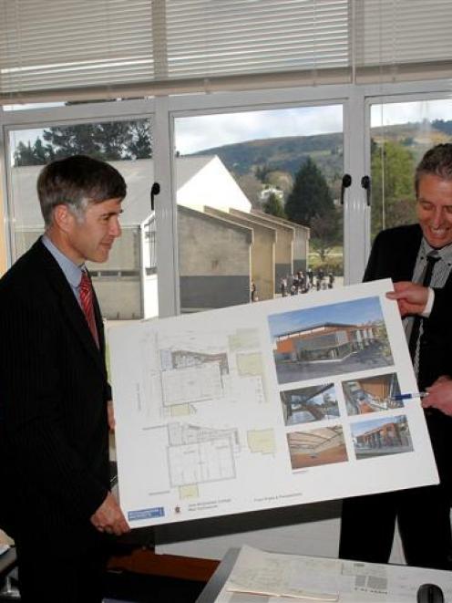 Looking at plans for John McGlashan College's new gymnasium are (from left) board of trustees...