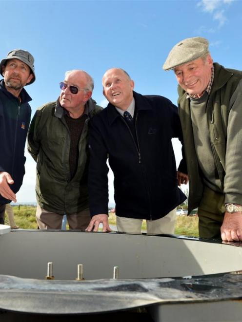 Looking into a new pump at the revamped Waipori pumping station at its commissioning yesterday...