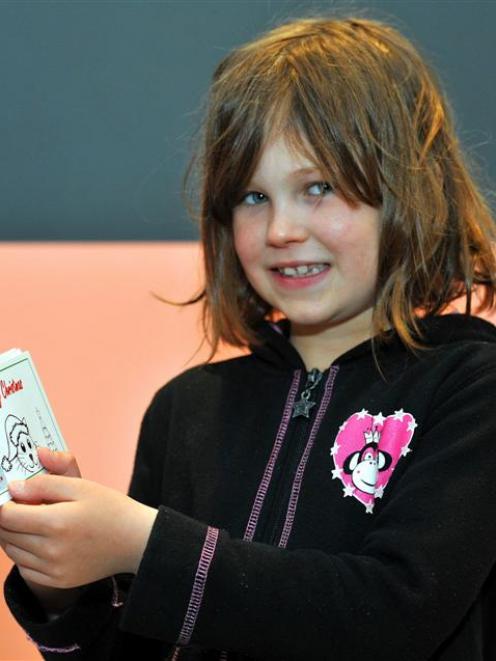 Lorelai Hunt, of Dunedin, with her newly issued chores cheque book, at the Big Value Christmas...