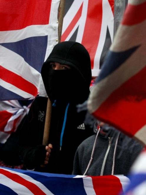 Loyalist protesters demonstrate against restrictions on flying Britain's union flag from Belfast...