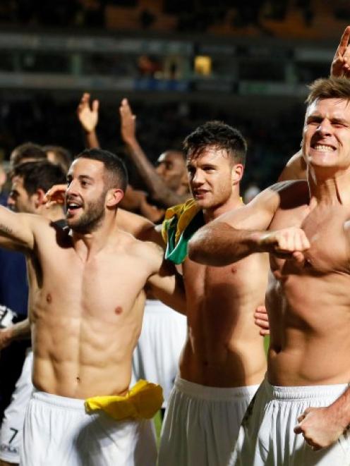 Luton Town's Janos Kovacs (R) celebrates with teammates after they beat Norwich City in their FA...