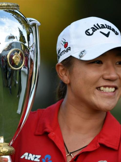 Lydia Ko holds the Canadian Open trophy. Photo: Reuters.