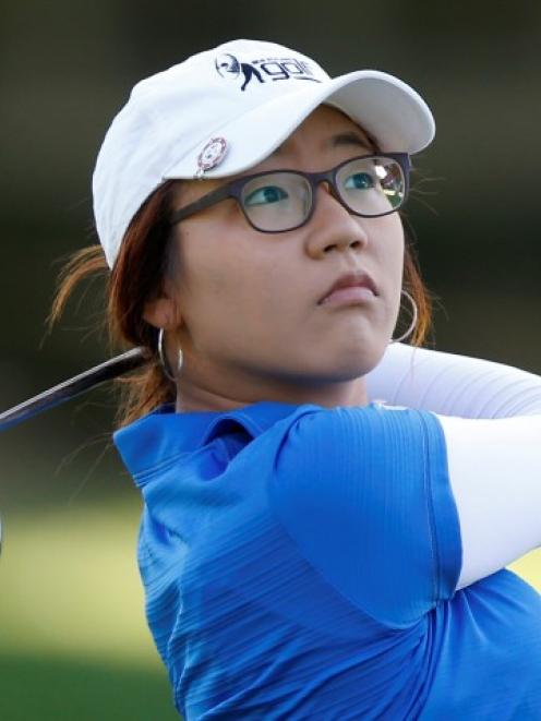 Lydia Ko of New Zealand hits from the 11th fairway during the first round of the Kraft Nabisco...