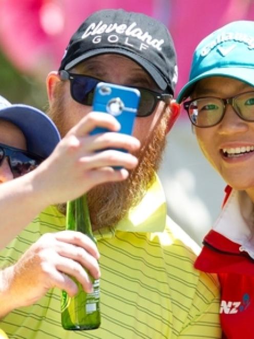 Lydia Ko poses for a selfie with golf partners Hayden Viles (left) and Dan McQuillan at Takapuna...
