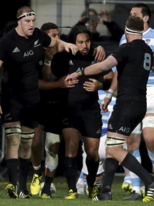 Ma'a Nonu (C) celebrates with teammates after scoring a try against Argentina in Christchurch...
