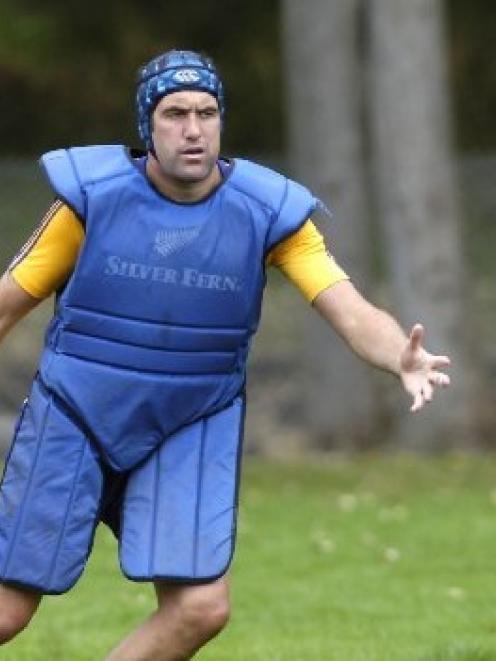 Highlanders lock Hoani MacDonald pads up as he takes part in a training drill at Logan Park. ...