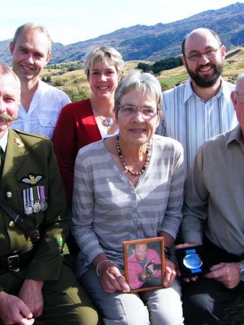 Mairi Speight and husband, David (right), with a picture of their son, Nicolas, and the Dag...