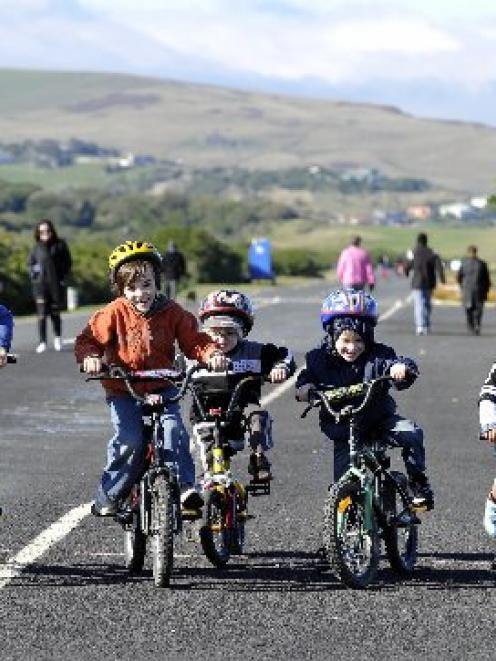 Making the most of a car-free John Wilson Ocean Dr, Dunedin, yesterday are (from left) Josh (7),...