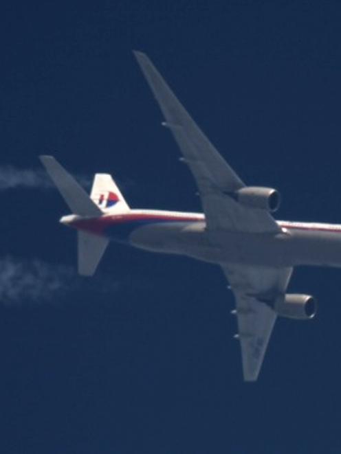 Malaysia Airlines Boeing 777 flight MH-17 with the registration number 9M-MRD flies over Poland...