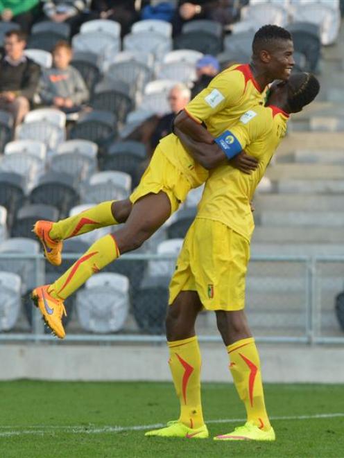 Mali's Youssouf Kone and Ichaka Diarra celebrate their team's  2-0 win over Mexico in the opening...