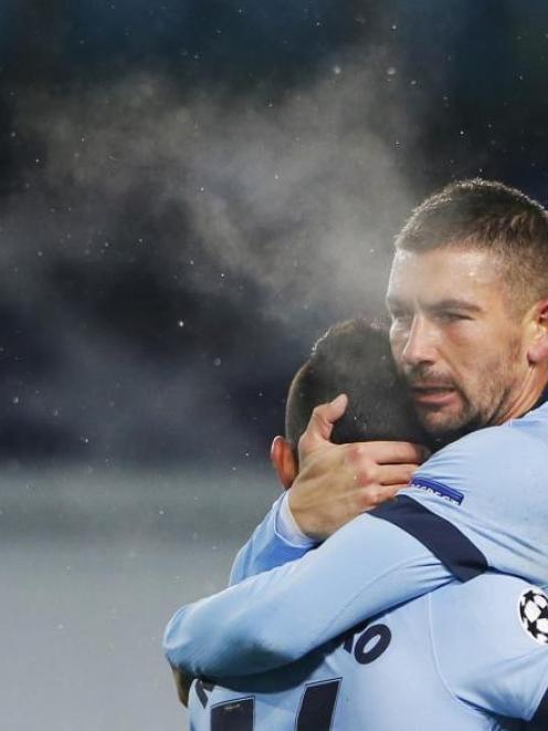 Manchester City's Sergio Aguero (left) is congratulated by teammate Aleksandar Kolarov after...
