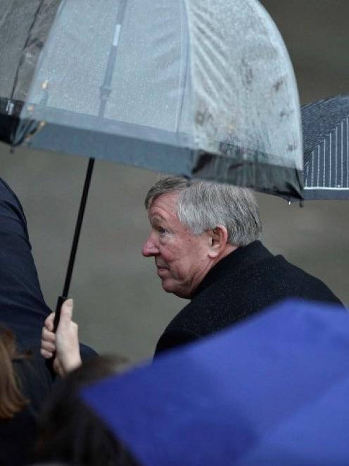 Manchester United manager Alex Ferguson attends the unveiling of a sculpture commemorating his...