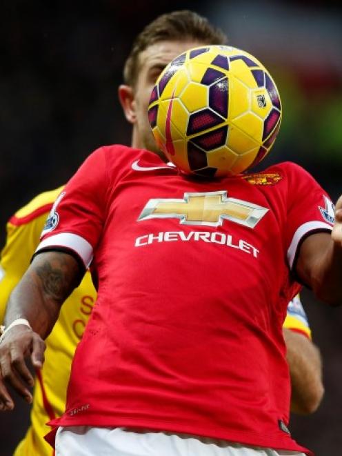 Manchester United's Ashley Young controls the ball during his team's Premier League match against...