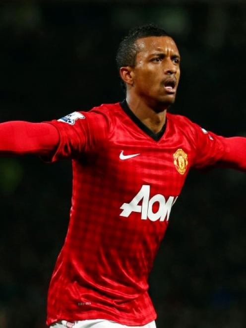 Manchester United's Nani celebrates after scoring his side's first goal against Reading during...