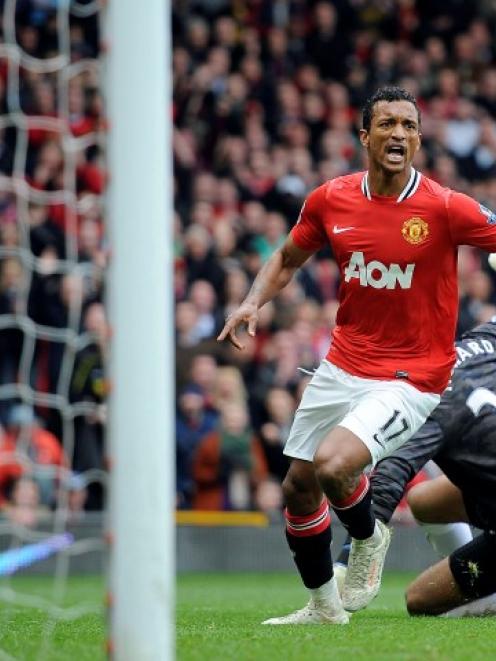 Manchester United's Nani celebrates scoring against Everton during their Premier League match in...