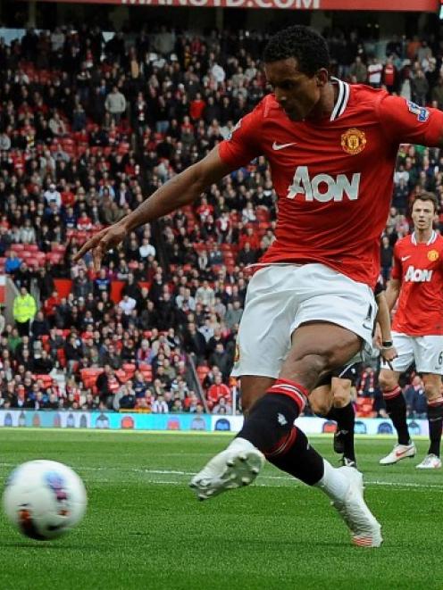 Manchester United's Nani shoots to score against Aston Villa during their Premier League match at...