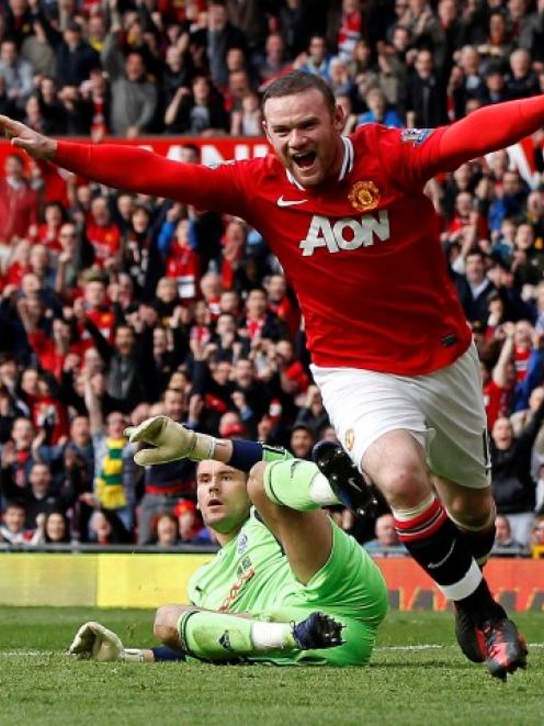 Manchester United's Wayne Rooney celebrates scoring against West Bromwich Albion during their...