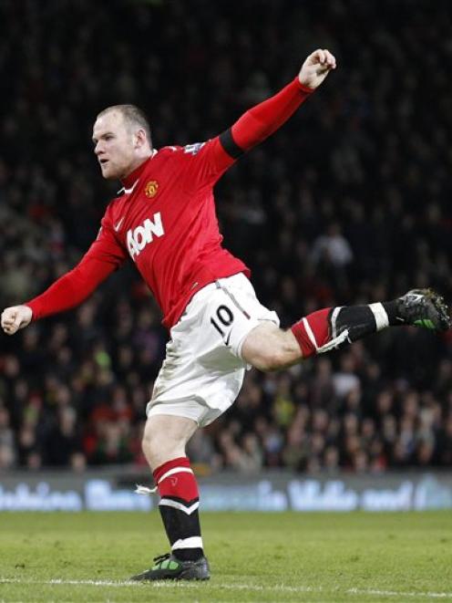 Manchester United's Wayne Rooney fires a shot at goal during his team's 3-1 win over Aston Villa...