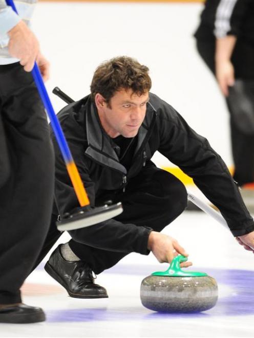 Maniototo skipper Sean Becker sends down a stone during his side's match against the Composite...