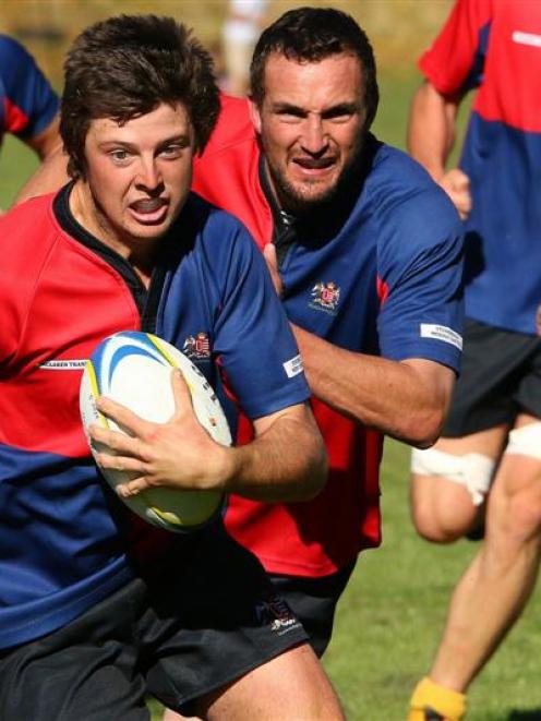 Maniototo winger Matt Holmes has Quinton Smith in support as he makes a break against Roxburgh in...