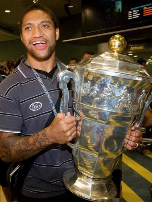 Manu Vatuvei arrives at the Auckland International Airport with the World Cup Sunday. (AP Photo...