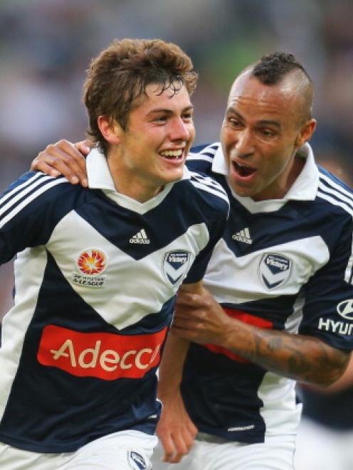 Marco Rojas (L) of the Melbourne Victory celebrates with Archie Thompson after scoring against...