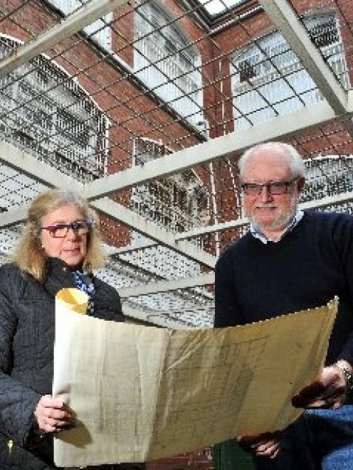 Margaret and Chris Betteridge survey an old layout plan of the historic Dunedin Prison, while...