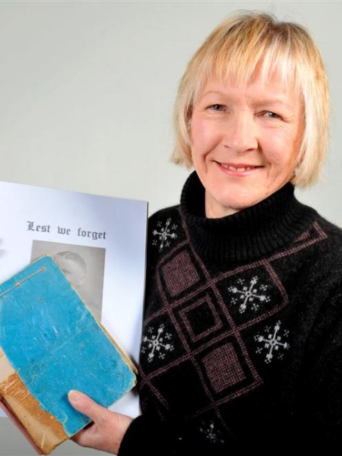 Margaret Pollock (59) with the original version and a digital version of her late father's diary...
