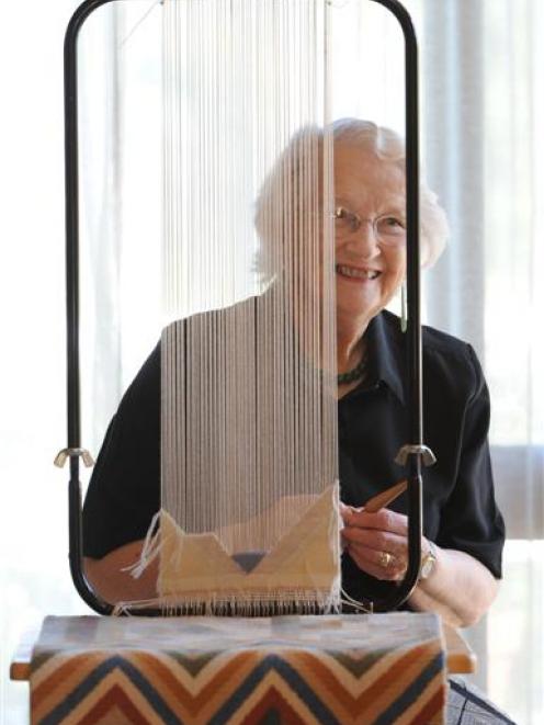 Margery Blackman works at her tapestry loom. Photo by Peter McIntosh.