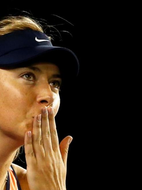 Maria Sharapova celebrates beating Lauren Davis. REUTERS/Thomas Peter