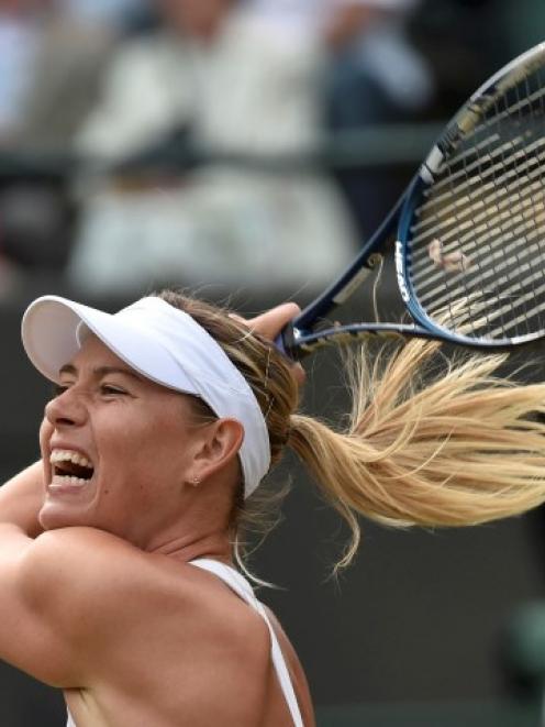 Maria Sharapova hits a return against Timea Bacsinszky. REUTERS/Toby Melville