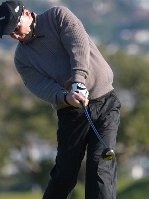 Mark Andrews drives from the 18th tee during the first round of the Otago foursomes championships...