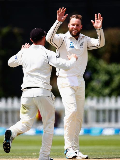 Mark Craig of New Zealand celebrates his wicket of Dinesh Chandimal of Sri Lanka during day five...