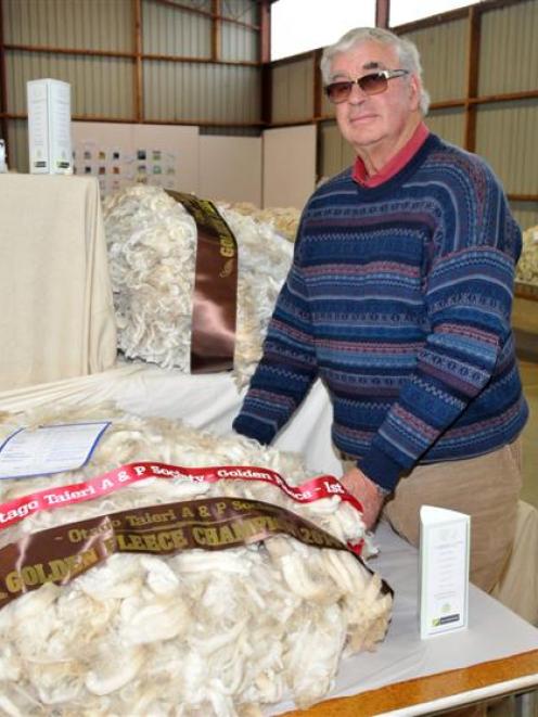 Martin Paterson views the winning fine-wool fleece in the Golden Fleece competition, entered by...