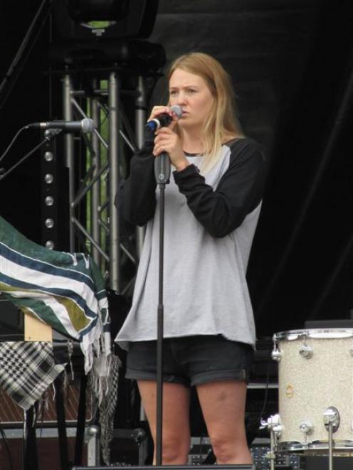 Martine Harding, of Wanaka, does a sound check for her group Arma Del Amor, the opening act at...